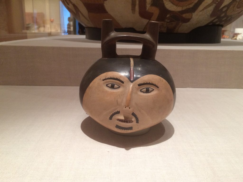 Small ceramic vessel formed and painted to appear like a bearded male head with strong with a strong widow's peak hairline